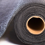 A close up of a grey roll of shade net.