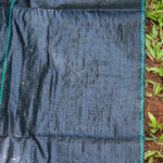 Close up of weed control fabric for garden shade.