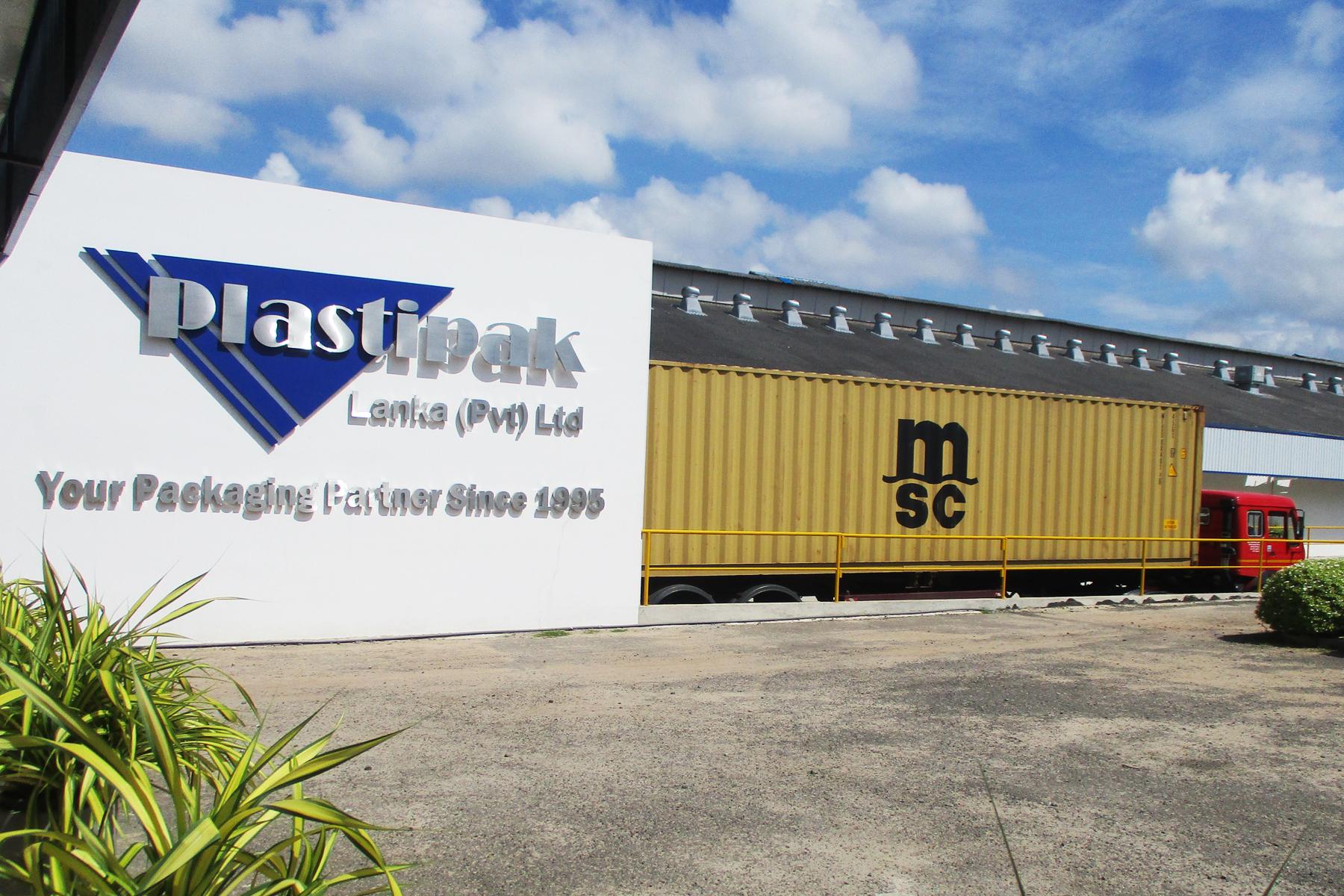 Plastipak company sign and truck.